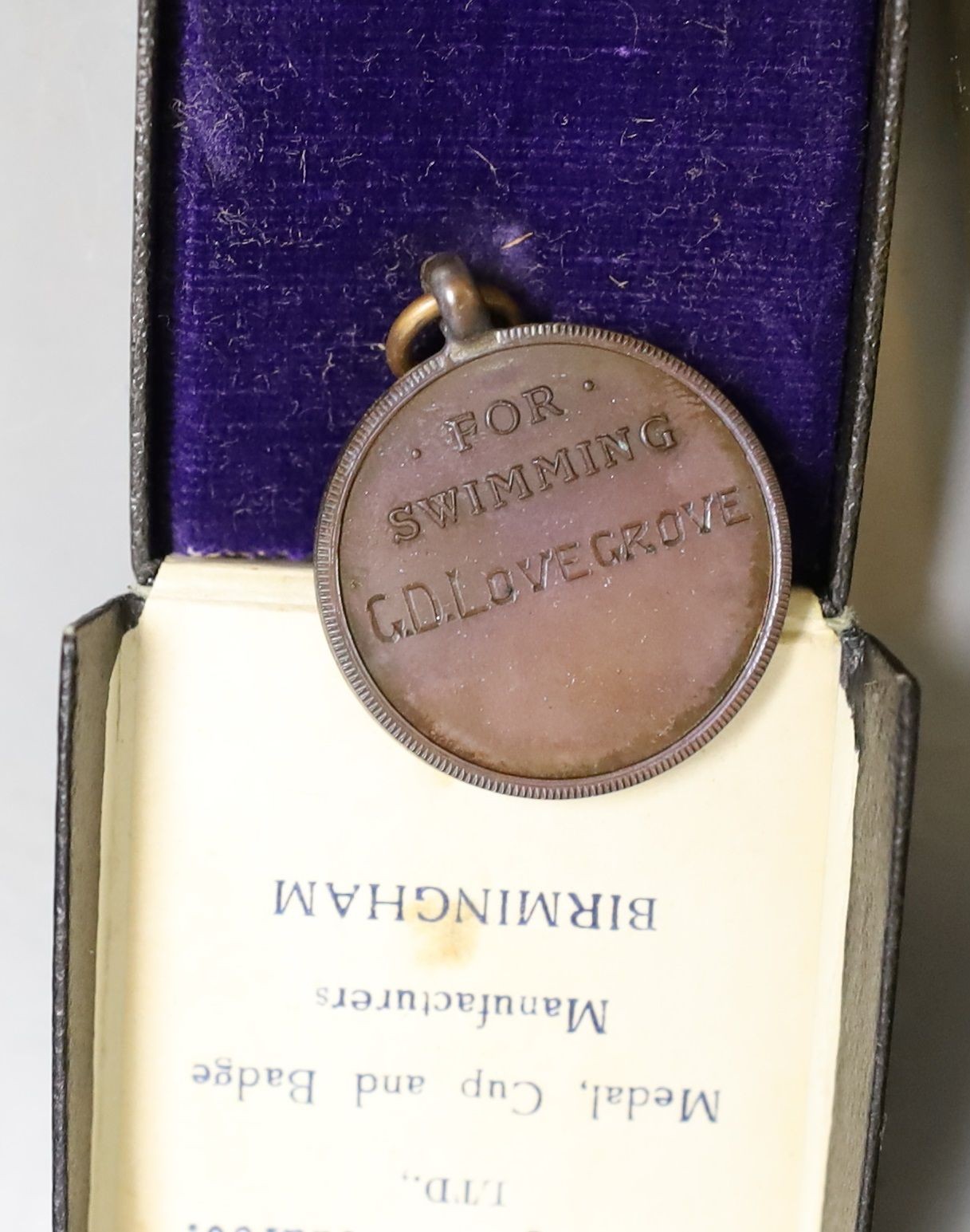 A WWI Queen Mary Christmas box, two National reserve London enamelled badges and two college medals to G. Lovegrove